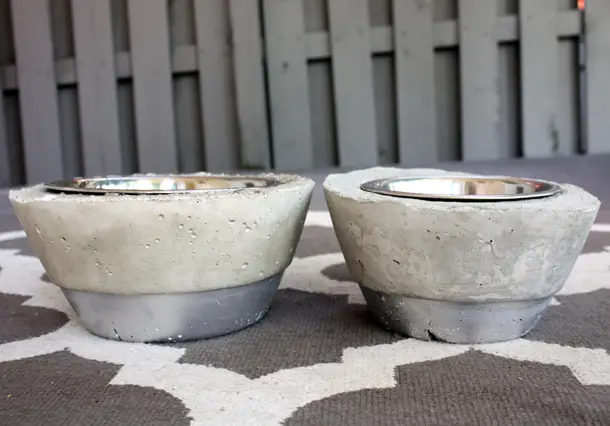 I wanted to make a DIY dog bowl holder, but all the tutorials I found were wood and required lots of tools. I wanted something I could do without any power tools, so I came up with these concrete dog bowl holders! They turned out pretty cool! Click through for a full video tutorial and photos of the process.